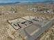 Sweeping aerial shot of desert home with large lot, distant mountain views, and ample space at 2330 Deadwood St, Pahrump, NV 89048