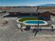 Expansive property featuring a pool, turf lawn, and large home, perfect for outdoor living and entertaining at 2330 Deadwood St, Pahrump, NV 89048