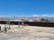 A spacious backyard featuring a pergola and views of snow-capped mountains at 2330 Deadwood St, Pahrump, NV 89048