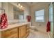 Bathroom featuring vanity, toilet, and enclosed shower at 2330 Deadwood St, Pahrump, NV 89048