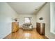 Bedroom showcasing hardwood floors and sitting area with mounted TV at 2330 Deadwood St, Pahrump, NV 89048