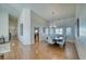 Spacious dining room featuring hardwood floors and modern chandelier at 2330 Deadwood St, Pahrump, NV 89048