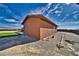 Side view of the home showcasing the unique architecture and the potential for outdoor activities at 2330 Deadwood St, Pahrump, NV 89048
