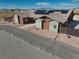 View of the exterior elevation with modern design, a paved driveway, and desert landscaping at 2330 Deadwood St, Pahrump, NV 89048