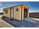 Charming storage shed with functional ramp offering secure storage for tools and equipment at 2330 Deadwood St, Pahrump, NV 89048
