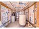 Interior of the water pressure tank shed with white insulation, equipped with water tanks and pumps at 2330 Deadwood St, Pahrump, NV 89048
