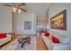 Inviting living room with hardwood floors and views into dining room at 2330 Deadwood St, Pahrump, NV 89048