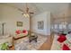 Bright living room with hardwood floors, vaulted ceilings, and neutral color palette at 2330 Deadwood St, Pahrump, NV 89048