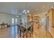Open-concept with an island, wood floors, and an eat-in dining area at 2330 Deadwood St, Pahrump, NV 89048