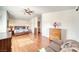 Bright main bedroom with hardwood floors and comfortable sitting area at 2330 Deadwood St, Pahrump, NV 89048