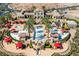 Expansive community pool area with cabanas and beautiful desert landscaping at the luxury home's location at 26 Via Vasari # 204, Henderson, NV 89011