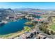Lakefront aerial view featuring lake, golf course and multi-story condominiums at 26 Via Vasari # 204, Henderson, NV 89011