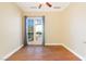 Bedroom with hardwood floors, french doors with balcony view and neutral paint at 26 Via Vasari # 204, Henderson, NV 89011