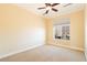 Bedroom featuring carpet, ceiling fan, a neutral palette, and a window providing natural light at 26 Via Vasari # 204, Henderson, NV 89011