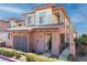 Charming two-story home featuring a stucco exterior, tile roof, and well-maintained landscaping at 26 Via Vasari # 204, Henderson, NV 89011