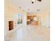 Spacious living room with fireplace and travertine flooring at 26 Via Vasari # 204, Henderson, NV 89011
