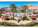 Beautiful outdoor pool with multiple shaded lounge areas and desert views surrounding the luxury property at 26 Via Vasari # 204, Henderson, NV 89011