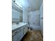Clean bathroom with tile flooring, vanity, and a shower/tub combo at 3058 Conquista Ct, Las Vegas, NV 89121