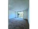 Neutral bedroom features a sliding glass door with backyard views at 3058 Conquista Ct, Las Vegas, NV 89121