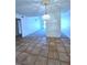 Bright dining room featuring tiled floors, decorative light fixture, and neutral walls at 3058 Conquista Ct, Las Vegas, NV 89121