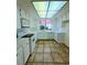 Bright kitchen features white cabinets and tiled countertops at 3058 Conquista Ct, Las Vegas, NV 89121