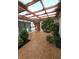 Enclosed patio with tiled flooring and mature landscaping at 3058 Conquista Ct, Las Vegas, NV 89121