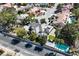 An expansive home with a well-kept yard, pool, and three-car garage stands out in this attractive neighborhood aerial view at 3111 Coachlight Cir, Las Vegas, NV 89117