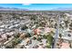 Expansive aerial view showcasing the charming home in a well-established, lush neighborhood with mountain views at 3111 Coachlight Cir, Las Vegas, NV 89117