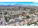Stunning aerial view displays a charming single-story home nestled in a lush community with mountain views at 3111 Coachlight Cir, Las Vegas, NV 89117