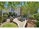 Beautiful backyard with lush landscaping, brick patio and a comfortable seating area, perfect for outdoor gatherings at 3111 Coachlight Cir, Las Vegas, NV 89117