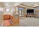 Home bar area with custom cabinetry, unique windows, and brick fireplace feature at 3111 Coachlight Cir, Las Vegas, NV 89117