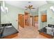 Bathroom with double sinks, granite countertops, walk-in shower, and ceiling fan at 3111 Coachlight Cir, Las Vegas, NV 89117