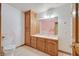 Bathroom featuring vanity with storage, a toilet, and tiled walls at 3111 Coachlight Cir, Las Vegas, NV 89117