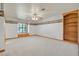Large bedroom with custom wallpaper, built-in bookshelves, and a window seat at 3111 Coachlight Cir, Las Vegas, NV 89117