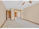 Bedroom featuring a mirrored closet and neutral-toned walls with wood trim at 3111 Coachlight Cir, Las Vegas, NV 89117