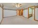 Spacious bedroom with detailed wallpaper, crown molding, and access to the ensuite at 3111 Coachlight Cir, Las Vegas, NV 89117