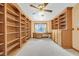 A room with custom wood built-in shelving and a desk area at 3111 Coachlight Cir, Las Vegas, NV 89117