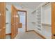 Walk-in closet features built-in shelving for organization and convenience at 3111 Coachlight Cir, Las Vegas, NV 89117