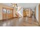 Grand entrance hall with hardwood floors, decorative doors, and a winding staircase at 3111 Coachlight Cir, Las Vegas, NV 89117