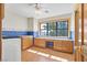 Functional laundry room featuring built-in cabinets and a window with views at 3111 Coachlight Cir, Las Vegas, NV 89117