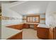Well-lit office space with custom built-in desk and cabinetry at 3111 Coachlight Cir, Las Vegas, NV 89117