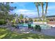 Serene backyard with a pool, rock waterfall, mature trees and lush lawn, perfect for relaxing and entertaining at 3111 Coachlight Cir, Las Vegas, NV 89117