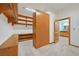 Walk-in closet with custom wood shelving, storage units and adjoining bath at 3111 Coachlight Cir, Las Vegas, NV 89117