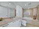 Modern bathroom with vanity, bathtub, and shower in neutral tones at 322 Karen Ave # 703, Las Vegas, NV 89109