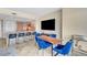 Modern living area with dining table, kitchen with breakfast bar, and flat screen TV at 322 Karen Ave # 703, Las Vegas, NV 89109