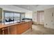 Open concept kitchen with stainless steel appliances, granite countertops, breakfast bar, dining area, and living room at 322 Karen Ave # 703, Las Vegas, NV 89109