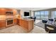 Modern kitchen with stainless steel appliances open to the living area and city views at 322 Karen Ave # 703, Las Vegas, NV 89109
