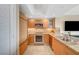 Modern kitchen with stainless steel appliances, granite countertops and tile flooring at 322 Karen Ave # 703, Las Vegas, NV 89109