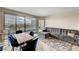 Living and dining area with floor-to-ceiling windows and city views at 322 Karen Ave # 703, Las Vegas, NV 89109