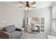 Bright bedroom with ceiling fan, neutral colors, and natural light at 3281 Pergusa Dr, Henderson, NV 89044